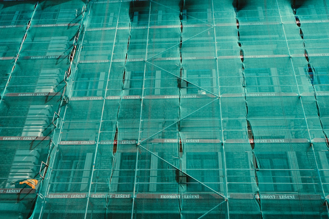 scaffolding covered by green net